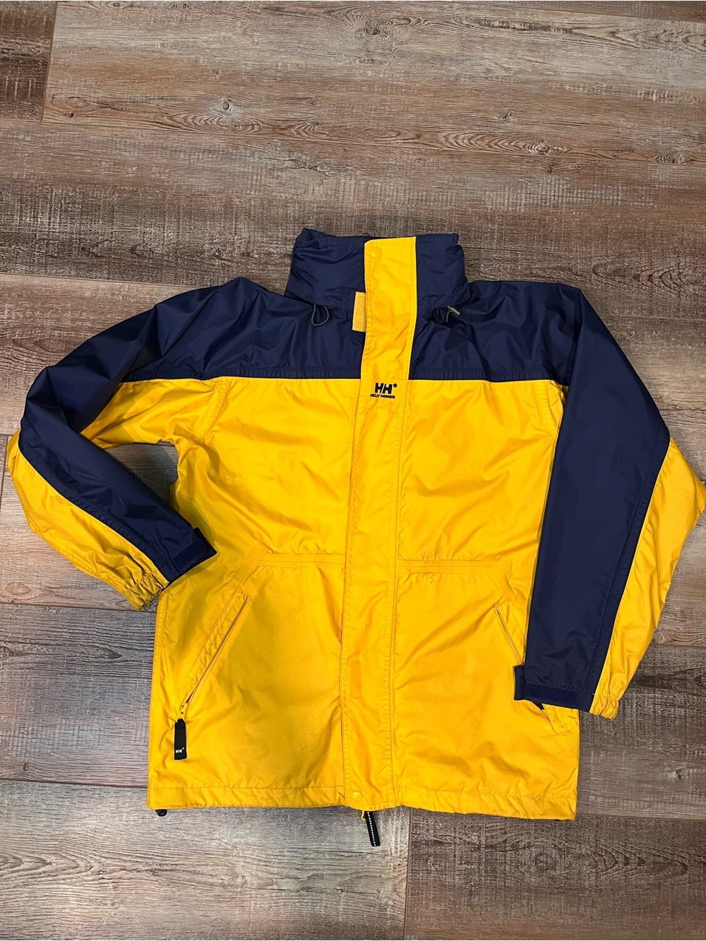 Helly Hanson rain jacket SZ. S. Blue & Gold